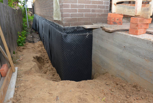 SJ Waterproofing Pros technician performing targeted Vapor Barrier Installation assessment in Packwaukee, WI